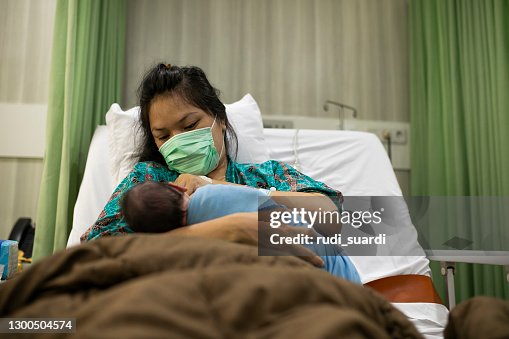 Mother with her newborn baby in the hospital Mother with her newborn baby in the hospital