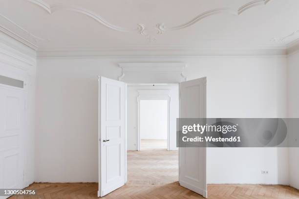 open doors in new renovated home - new building opening stock pictures, royalty-free photos & images