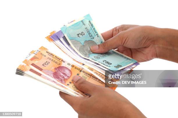 counting indian currecy notes - indian currency stock pictures, royalty-free photos & images