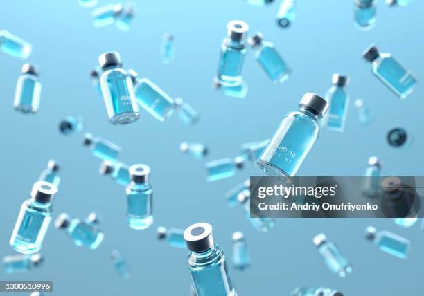 covid-19 vaccine bottles falling - infectious disease no people stock pictures, royalty-free photos & images