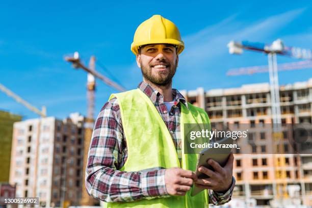 construction worker or engineer using digital tablet - property developer stock pictures, royalty-free photos & images