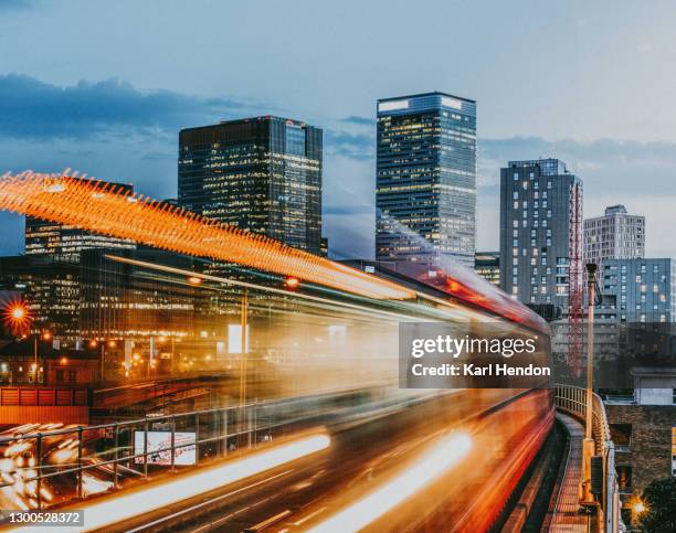 a dusk view of the london skyline - railways uk stock-fotos und bilder