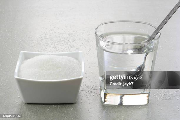 sugar water - jarabe fotografías e imágenes de stock