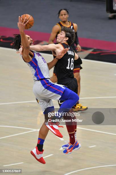 Jahlil Okafor of the Detroit Pistons is fouled by Cedi Osman of the Cleveland Cavaliers during the fourth quarter at Rocket Mortgage Fieldhouse on...