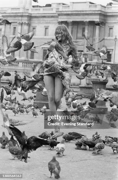 American actress Laurie Bird amongst the pigeons in Trafalgar Square, London, UK, 14th March 1973.