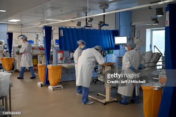 Staff at University Hospital Monklands attend to Covid-positive patients on the ICU ward on February 5, 2021 in Airdrie, Scotland. The numbers of...