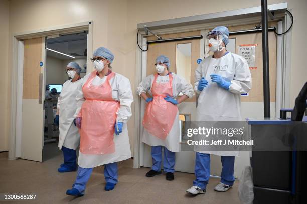 Staff at University Hospital Monklands gather outside the ICU ward on February 5, 2021 in Airdrie, Scotland. The numbers of patients with Coronavirus...
