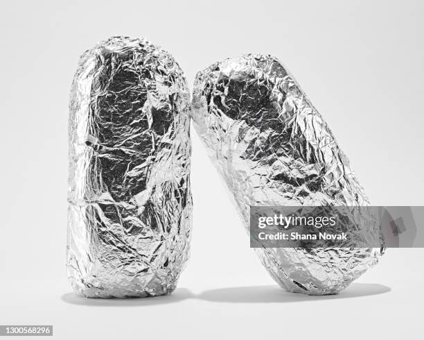 burritos wrapped in foil - burrito stockfoto's en -beelden