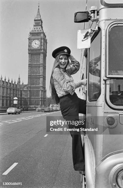 British actress Jane Seymour boards a bus outside the Palace of Westminster in London, UK, 26th April 1973. She starred in the James Bond film 'Live...