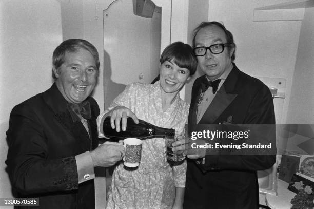 British comedy duo Eric Morecambe and Ernie Wise celebrating with actress Glenda Jackson, UK, 18th April 1973.