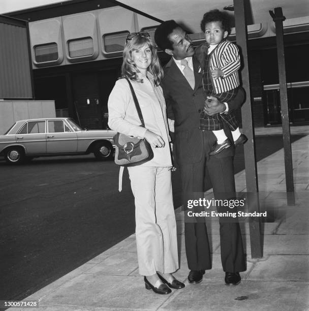 West Indian cricketer Garfield Sobers at Heathrow Airport in London with his wife Prue and their son Matthew, UK, 23rd April 1973. Sobers has arrived...