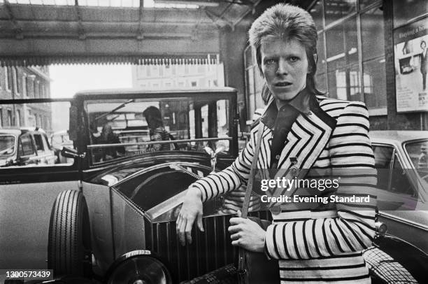 English singer, songwriter and actor David Bowie arrives at King's Cross Station in London, en route to Aberdeen in Scotland for the next leg of his...