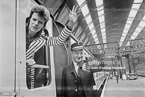 English singer, songwriter and actor David Bowie leaves King's Cross Station in London, en route to Aberdeen in Scotland for the next leg of his...
