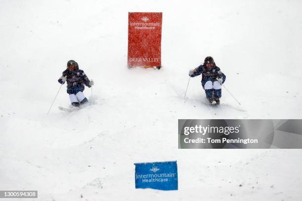 Tess Johnson of the United States skis against Kai Owens of the United States during a run for the Women's Dual Moguls during the 2021 Intermountain...