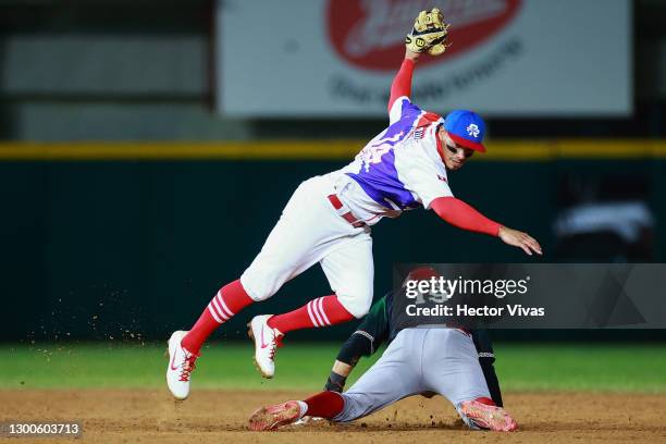 Ramiro Pena of Tomateros de Culiacán of Mexico slides safely into second base against Edwin Diaz of Criollos de Caguas of Puerto Rico in the 4th...