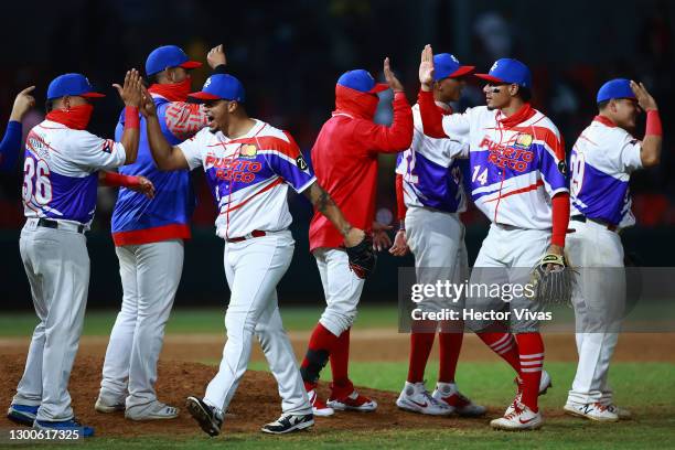 Players of Puerto Rico celebrate after winning the match between Puerto Rico and Mexico as part of Serie del Caribe 2021 at Teodoro Mariscal Stadium...