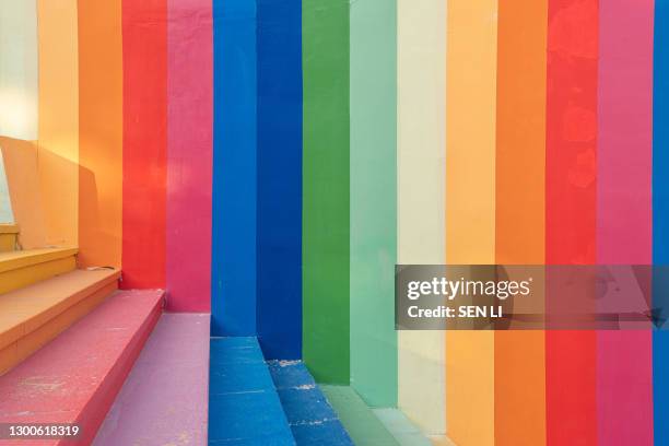 colorful stairs and colorful wall background - pink wall stock-fotos und bilder