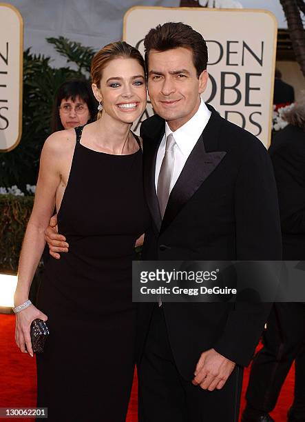 Denise Richards and Charlie Sheen arrive at the Golden Globe Awards at the Beverly Hilton January 20, 2002 in Beverly Hills, California.