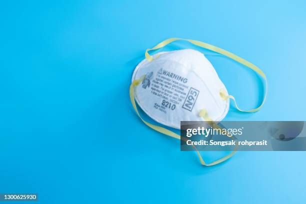 close-up of n95 respirator (face mask), personal protective equipment (ppe), suitability is critical. - n95 face mask fotografías e imágenes de stock