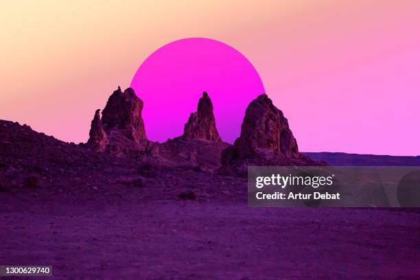 colorful surreal landscape in the california desert with big pink sun. - idyllic retro stock pictures, royalty-free photos & images