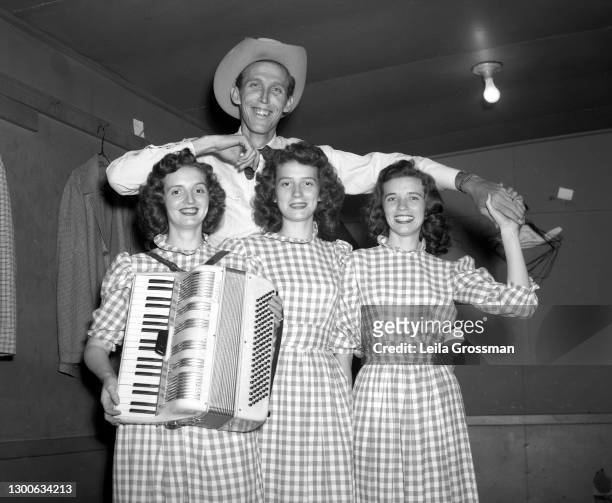 Country singer songwriters the Carter Sisters pose for a portrait backstage at the Grand Ole Opry in 1951 in Nashville, Tennessee.