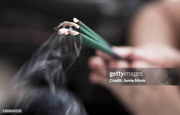 prayer and incense - incense stock pictures, royalty-free photos & images