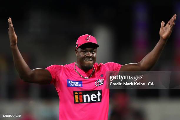 Carlos Brathwaite of the Sixers encourages the crowd as the Sixers near celebrating victory during the Big Bash League Final match between the Sydney...