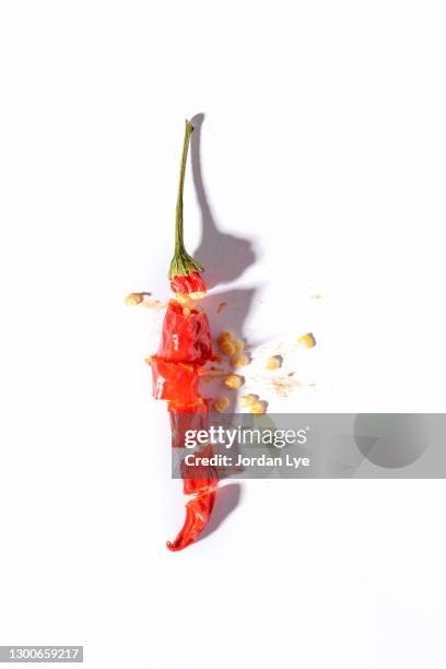 sliced red chili pepper on white background - chili pepper on white stock pictures, royalty-free photos & images