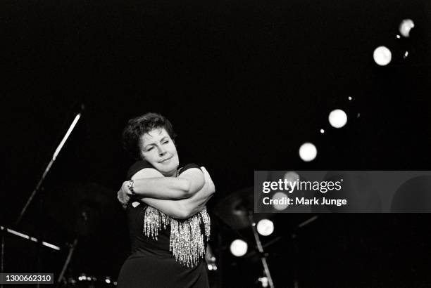 Australian-American singer Helen Reddy performs at the Cheyenne Civic Center on November 7, 1990 in Cheyenne, Wyoming. Dubbed by the Chicago Tribune...