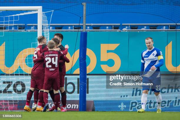 Fabian Schleusener of Nuernberg celebrates his team's first goal with his team mates during the Second Bundesliga match between SV Darmstadt 98 and...