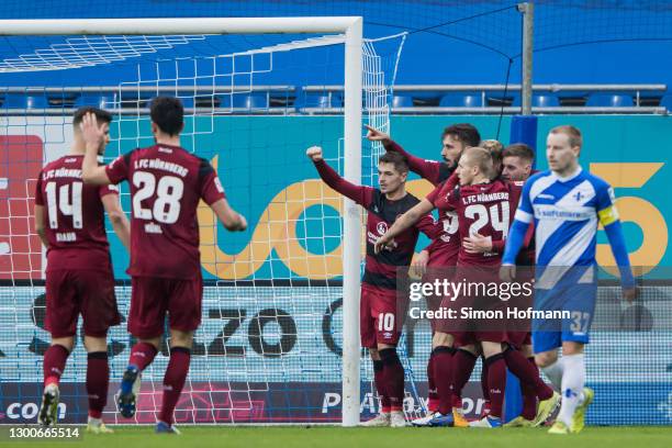 Fabian Schleusener of Nuernberg celebrates his team's first goal with his team mates during the Second Bundesliga match between SV Darmstadt 98 and...