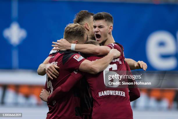 Team mates of Nuernberg celebrate winning during the Second Bundesliga match between SV Darmstadt 98 and 1. FC Nürnberg at Jonathan-Heimes-Stadion am...