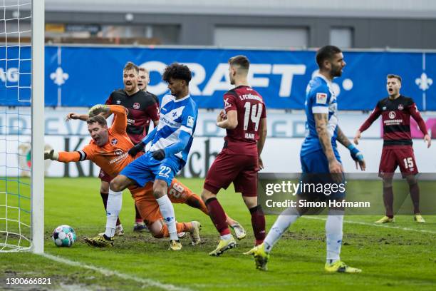 Aaron Seydel of Darmstadt scores a disallowed goal past Goalkeeper Christian Mathenia of Nuernberg during the Second Bundesliga match between SV...