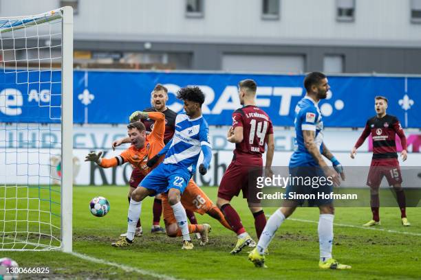 Aaron Seydel of Darmstadt scores a disallowed goal past Goalkeeper Christian Mathenia of Nuernberg during the Second Bundesliga match between SV...