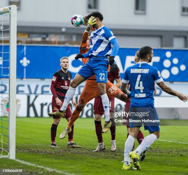 Aaron Seydel of Darmstadt scores a disallowed goal past Goalkeeper Christian Mathenia of Nuernberg during the Second Bundesliga match between SV...