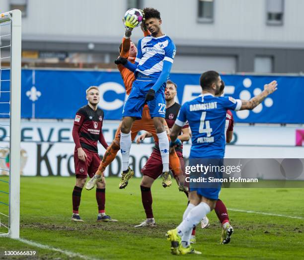 Aaron Seydel of Darmstadt scores a disallowed goal past Goalkeeper Christian Mathenia of Nuernberg during the Second Bundesliga match between SV...