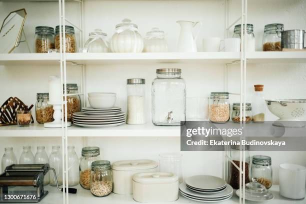 shelves in the kitchen with dishes and spices - kitchen shelves stock pictures, royalty-free photos & images