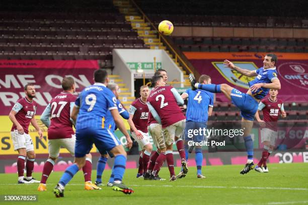 Lewis Dunk of Brighton and Hove Albion scores his team's first goal during the Premier League match between Burnley and Brighton & Hove Albion at...