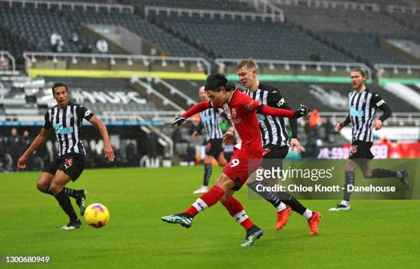 Takumi Minamino of Southampton scores their first goal during the Premier League match between Newcastle United and Southampton at St. James Park on...