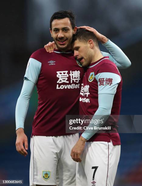 Johann Gudmundsson of Burnley celebrates with teammate Dwight McNeil after scoring his team's first goal during the Premier League match between...