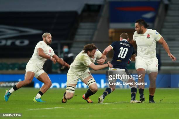 Billy Vunipola of England performs a high tackle on Finn Russell of Scotland resulting in a yellow card during the Guinness Six Nations match between...