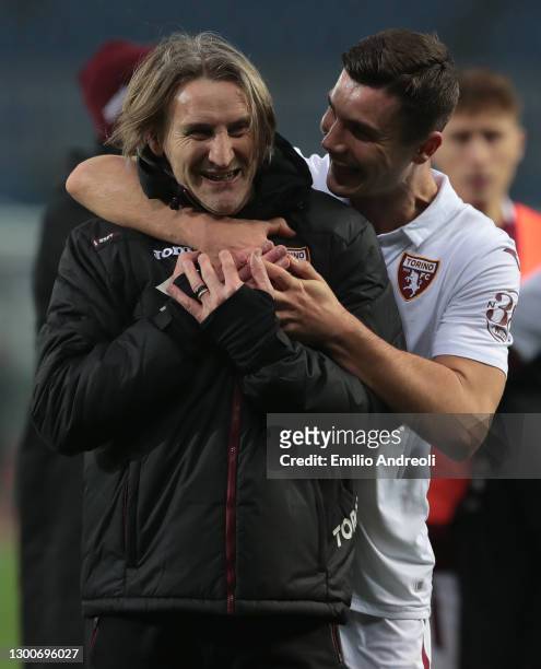 Torino FC coach Davide Nicola celebrates with his player Amer Gojak at the end of the Serie A match between Atalanta BC and Torino FC at Gewiss...