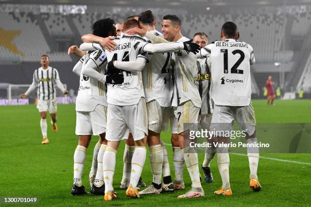 Juan Cuadrado, Dejan Kulusevski, Alex Sandro, and Cristiano Ronaldo of Juventus celebrate with their teammates following their team's second goal, an...