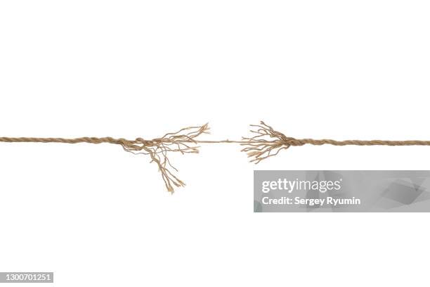 breaking rope on a white background - breaking apart stock pictures, royalty-free photos & images