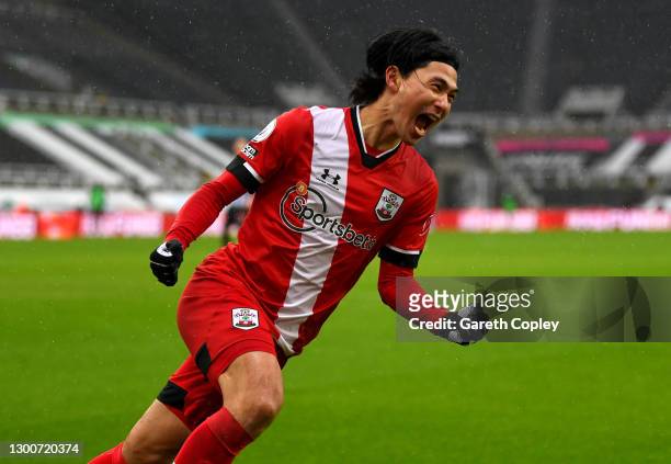 Takumi Minamino of Southampton celebrates after scoring their side's first goal during the Premier League match between Newcastle United and...