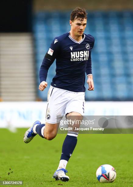 Jake Cooper of Millwall FC runs with the ball during the Sky Bet Championship match between Millwall and Sheffield Wednesday at The Den on February...