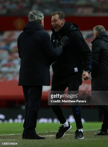Manager Carlo Ancelotti and Assistant Manager Duncan Ferguson of Everton celebrate during the Premier League match between Manchester United and...