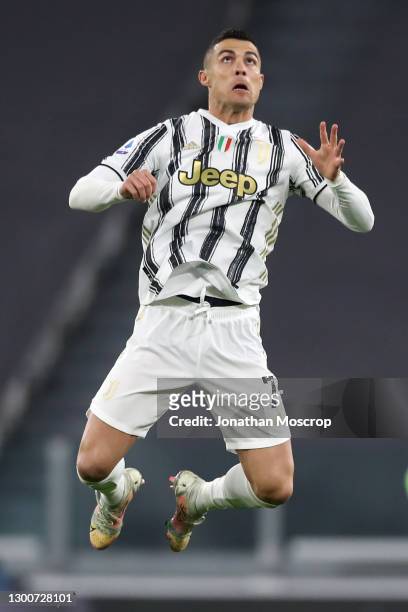 Cristiano Ronaldo of Juventus leaps for the ball during the Serie A match between Juventus and AS Roma at Allianz Stadium on February 06, 2021 in...