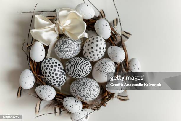 easter wreath with willow branches, eggs and feathers. - easter wreath stock pictures, royalty-free photos & images