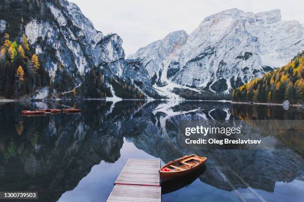 amazing autumn landscape of famous tourist destination lago di braies in italy - lago reflection stock pictures, royalty-free photos & images